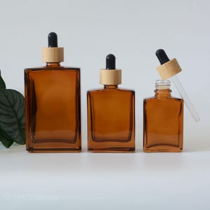 1oz 30ml 50ml 100ml Flaconi contagocce in vetro ambrato trasparente in bambù naturale Imballaggio cosmetico di vendita calda Colore del tè per la cura personale della pelle LOGO Make