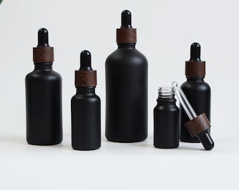 5ml 10ml 15ml 20ml 30ml 50ml 100ml Hot Sale Dropper Bottle Frosted Black Bottle Wood Look Black Cap For Cosmetic Packaging Toner Oil Dropper