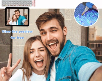 May include: A couple smiling and taking a selfie. The image is a mock-up of a custom diamond painting. The text "View the preview for free" and "Custom Diamond Painting" is visible in the image.