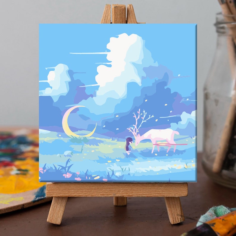 May include: A painting on canvas depicting a girl in a blue dress interacting with a white deer in a field with a crescent moon and blue sky with clouds.