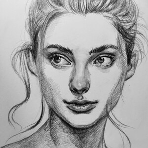 May include: A black and white pencil drawing of a woman's face. The woman has long hair pulled back from her face and is looking directly at the viewer. Her expression is soft and thoughtful.