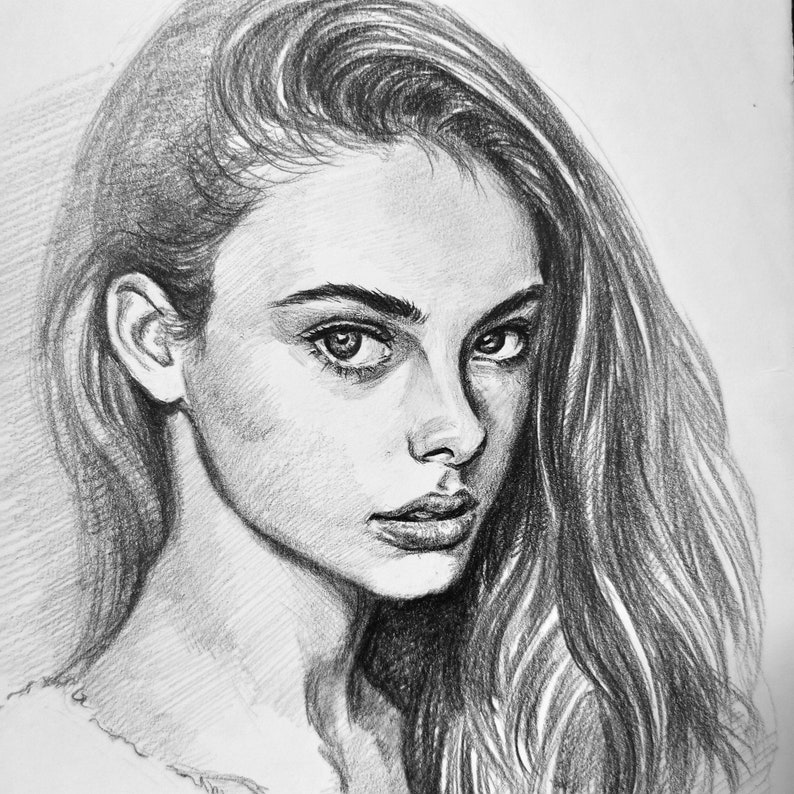 May include: A black and white pencil drawing of a woman with long, flowing hair. Her eyes are looking directly at the viewer, and her expression is serious.