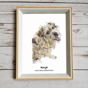 May include: A framed illustration of a brown and white dog with a pink collar. The dog is looking to the right and has its mouth slightly open. The text "Ronja unsere kleine R&auml;ubertochter" is printed below the dog.
