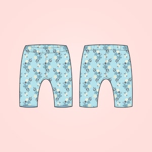 May include: A pair of light blue leggings with a floral pattern. The leggings have a white background with blue and cream flowers.
