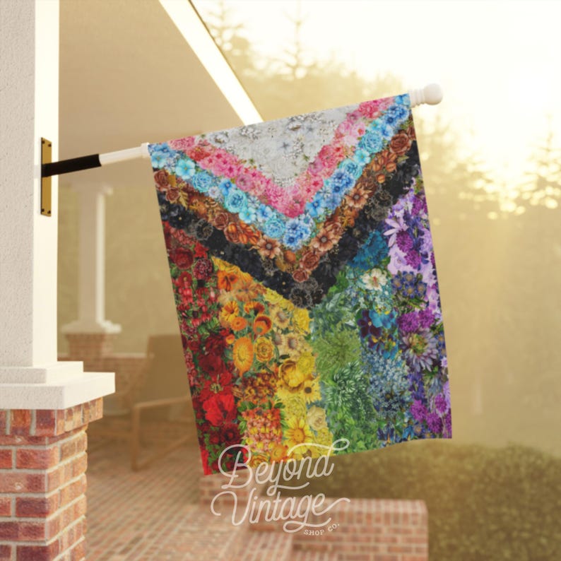a colorful quilt hanging on a clothes line
