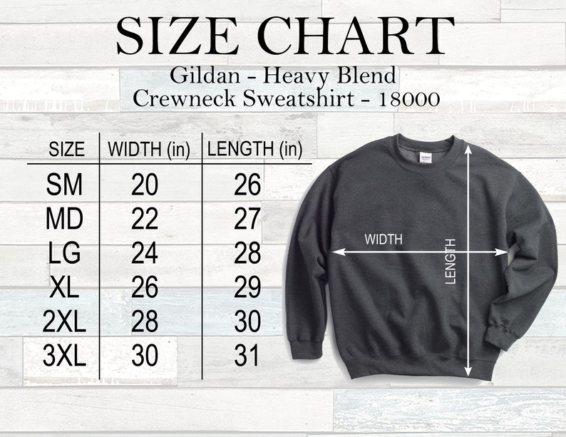 May include: A size chart for a Gildan Heavy Blend crewneck sweatshirt. The chart lists sizes SM to 3XL, with corresponding width and length measurements in inches. A dark grey sweatshirt is shown with width and length indicators.