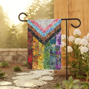 a picture of a colorful quilt hanging on a rack