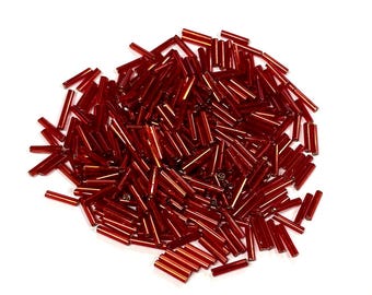 20 gramów czerwonych, posrebrzanych koralików w kształcie trąbki o średnicy 9 mm (nr ST5-149)