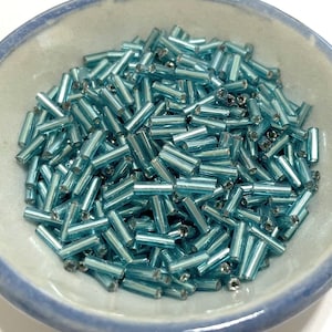 20 Grams of Turquoise Blue Silver Lined Bugle Beads 6mm(No.BST81-134)