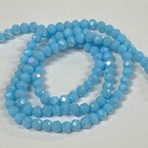 1 rang de perles de cristal de verre facettées rondes AB 4 mm bleu. N°74-904
