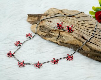 Koraalkleurige sieradenset: sterlingzilveren ketting en oorbellen