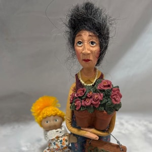 Vintage 1970s Garden Club Lady Figurine with Cabbage Patch Kid Clip on Hugger Doll
