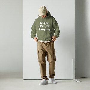Never Stop Praying (white praying hands) - Unisex Hoodie
