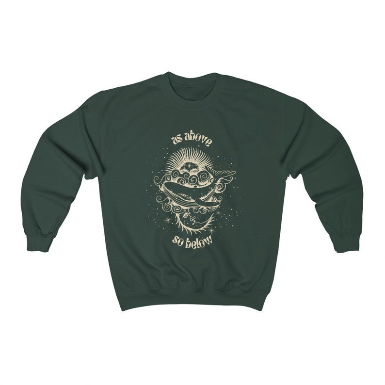 May include: A dark green sweatshirt with a white graphic print of a whale and the text "as above so below".
