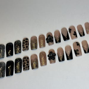 Midnight Luxe Black and Gold Glam Press On Nails. Bold glam meets glitter in this luxurious black and gold press on set