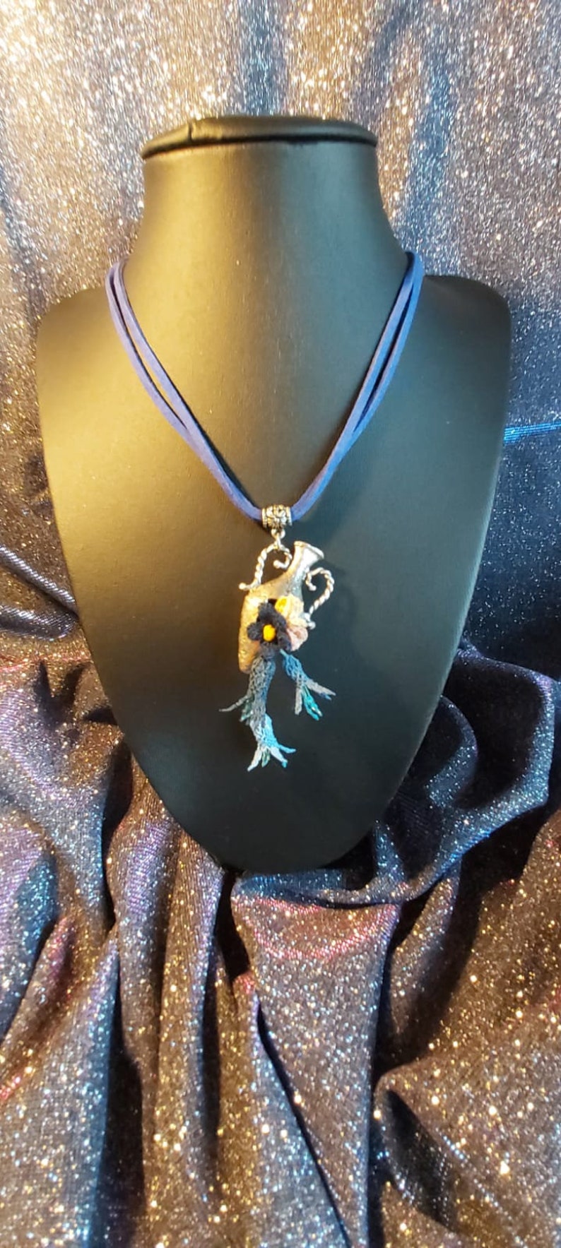 Handmade needle lace necklace on metal Special design.