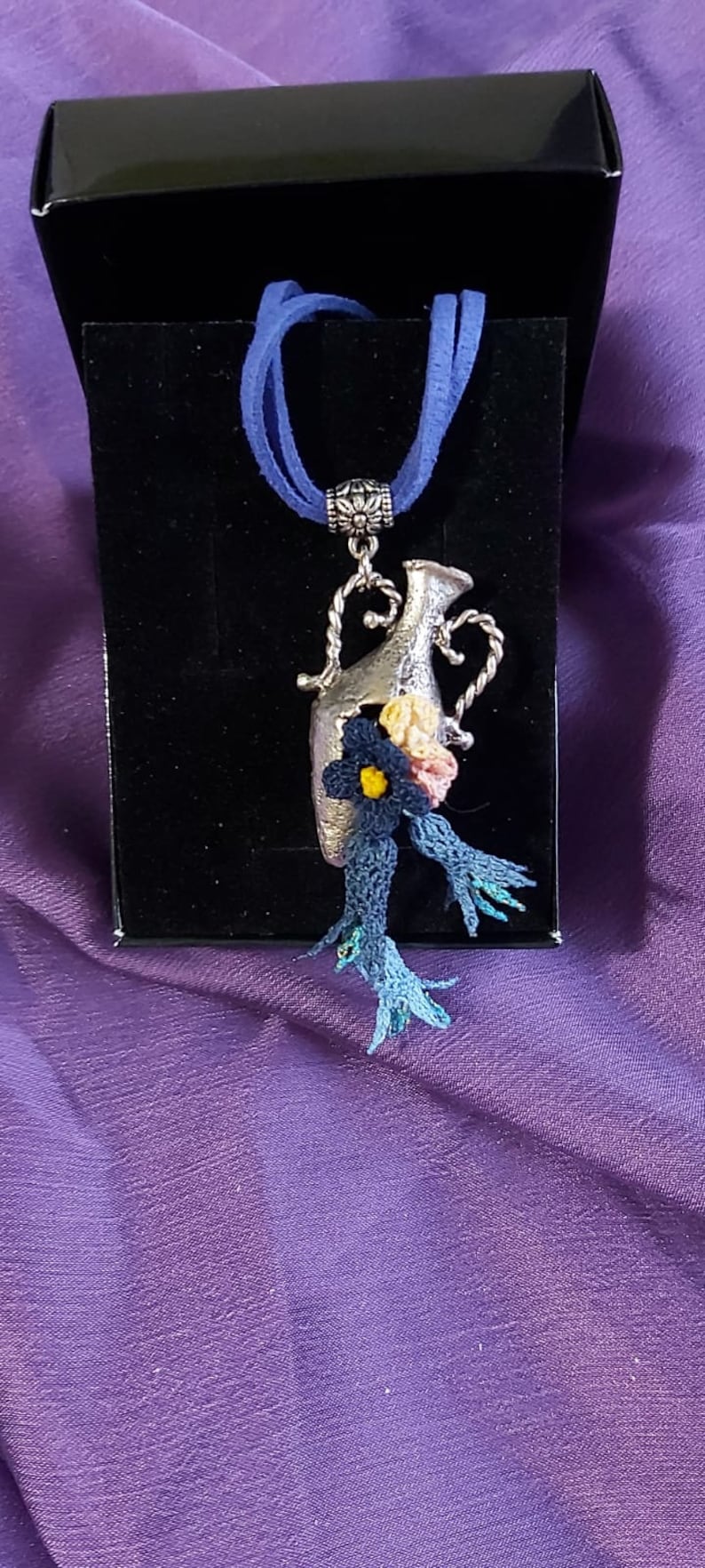 Handmade needle lace necklace on metal Special design.