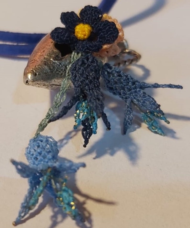 Handmade needle lace necklace on metal Special design.