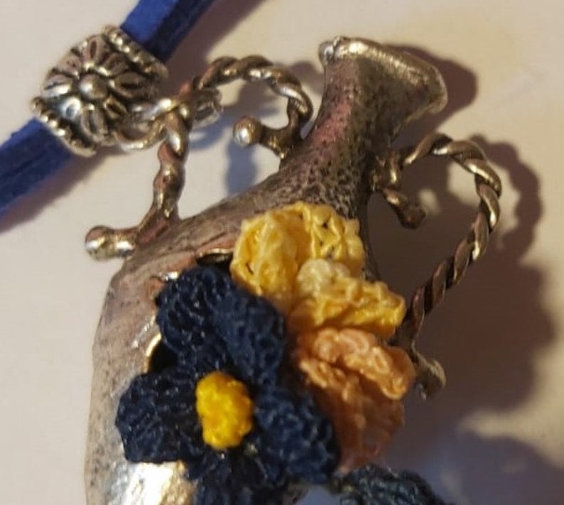 Handmade needle lace necklace on metal Special design.
