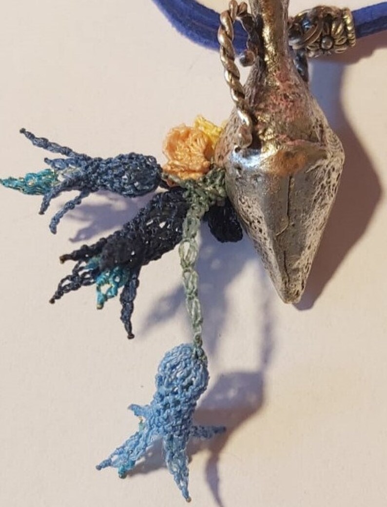 Handmade needle lace necklace on metal Special design.