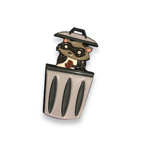 cute raccoon enamel pin, raccoon in garbage can, funny interactive pins, unique gifts for raccoon lover, surprise trash panda with cookie