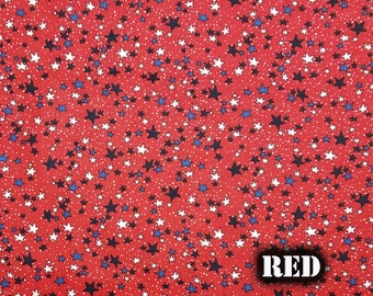 May include: Red fabric with a pattern of white, blue, and navy stars. The word "RED" is displayed in a white box in the lower right corner. The fabric is measured in inches.