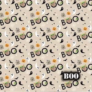 May include: A beige fabric with a repeating pattern of green characters saying "BOO" with a pumpkin, ghost, bat, and spider web design.