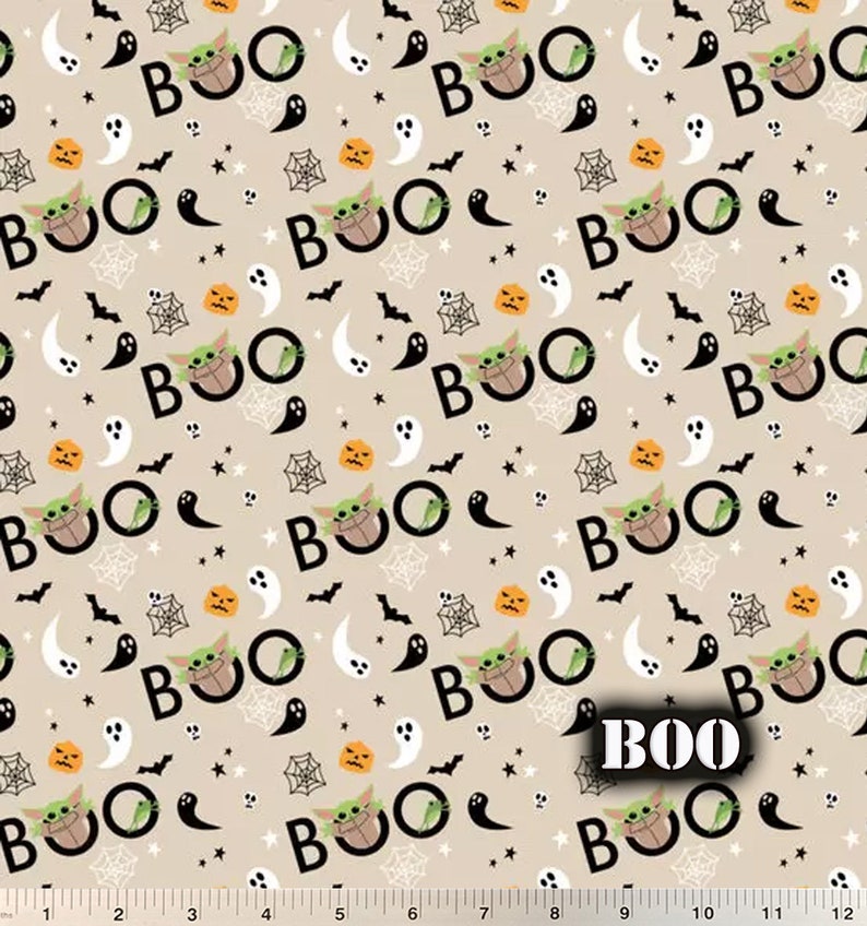 May include: A beige fabric with a repeating pattern of green characters saying "BOO" with a pumpkin, ghost, bat, and spider web design.