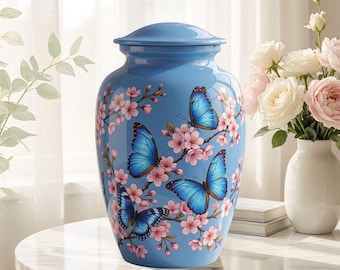 Urna funeraria conmemorativa de flores de cerezo y mariposa azul para cenizas, urna floral personalizada, elegante homenaje a la naturaleza, regalo de condolencia