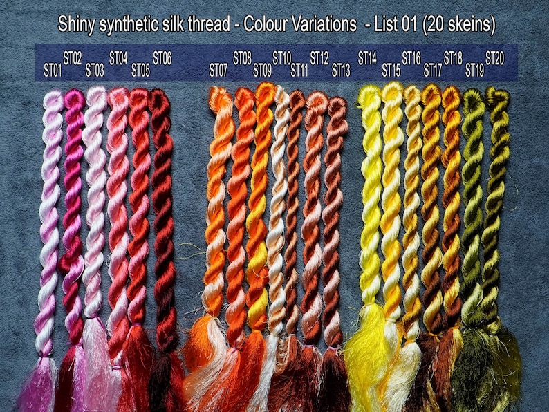 May include: Twenty skeins of shiny synthetic silk thread in a variety of colors, from pink to green. The skeins are labeled with numbers from ST01 to ST20.