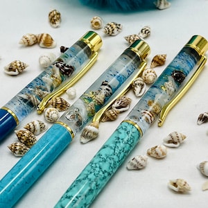 Ocean float pen. Nautical seashells, sand, golden seahorse and seaweed snow globe pens. Hold onto summer a bit longer gift