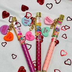 Valentine’s Day candy hearts float pen. Conversation hearts snow globe glitter charm pen. Cute planner pens, teachers gifts.