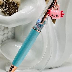 Kawaii axolotl float pen. Adorable pen pet axolotl love snow globe pen. Fun school, work, office or planner pen gift.