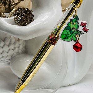 Grinch float pen. You’re a mean one Christmas snow globe charm pen. Classic holiday characters planner pen, stocking stuffer, gift.