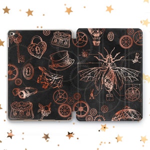 May include: A black and rose gold iPad case with a steampunk design. The case features gears, a hot air balloon, a key, a lock, a hat, a plane, a bee, and other intricate details.
