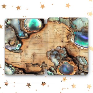 May include: A wood-grain patterned phone case with iridescent blue, green, and purple accents. The case is made of a hard plastic material and has a smooth finish.