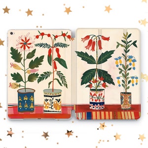 May include: A two-piece tablet case featuring a colorful floral design. The case displays four potted plants with red, yellow, and blue flowers. The pots have intricate patterns and sit on a red shelf against a cream background.
