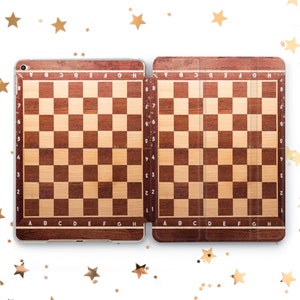 May include: A brown wooden chessboard case for an iPad. The case has a wood grain pattern and is divided into two sections, each with a chessboard design. The case is closed and the iPad is not visible.