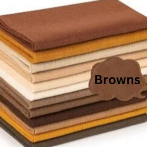May include: A stack of fabric swatches in various shades of brown, beige, and yellow. The swatches are labeled "Browns".