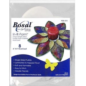 May include: A package of Bosal In-R-Form fusible foam stabilizer for quilting. The package features a floral design with a red candle in the center. The product is 5" x 8" and is designed for beginner quilters.