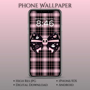 May include: A smartphone displays a pink and black plaid wallpaper with a bow featuring a skull and ghost design. The time reads 8:46 on Wednesday, October 1. The words "PHONE WALLPAPER" are at the top.