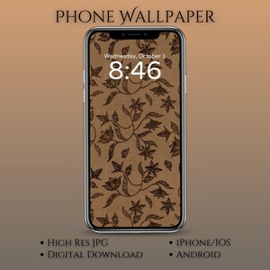 Op de afbeelding: Een smartphone met een bruin bloemenpatroon behang. Het scherm toont de datum en tijd: woensdag 1 oktober, 8:46. De telefoon is gelabeld met "PHONE WALLPAPER". Extra tekst omvat "HIGH RES JPG", "DIGITAL DOWNLOAD", "IPHONE/IOS" en "ANDROID".