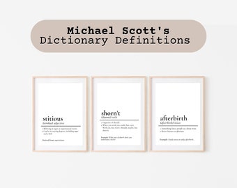 May include: Three framed prints with definitions, including "stitious," "shorn't," and "afterbirth." The prints have a white background with black text, and are displayed under a banner that reads "Michael Scott's Dictionary Definitions."