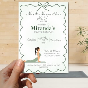 May include: A white rectangular invitation card with a scalloped dark green border and a bow graphic at the top. The text reads Meet Me on the Mat! You're invited to Miranda's Pilates Birthday, October 19th 2025, 9am-11am, Pilates Haus, 4056 Sheerdale Ave.