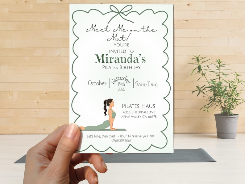 May include: A white rectangular invitation card with a scalloped dark green border and a bow graphic at the top. The text reads Meet Me on the Mat! You're invited to Miranda's Pilates Birthday, October 19th 2025, 9am-11am, Pilates Haus, 4056 Sheerdale Ave.