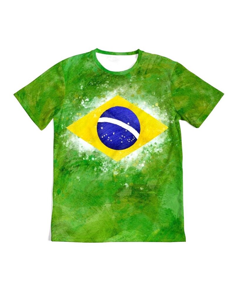 May include: Green t-shirt featuring the Brazilian flag. The shirt has a watercolor effect with a green background and a yellow diamond containing a blue circle with white stars and a white band.