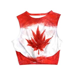 May include: A sleeveless crop top featuring the Canadian flag design. The top has a red and white color scheme, with a large red maple leaf in the center. The top is made of a soft, lightweight material.