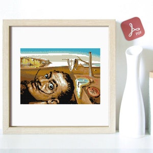 Peut inclure: Un motif de point de croix encadré de La Persistance de la mémoire de Salvador Dali. L'œuvre d'art présente une horloge qui fond, un paysage désertique et un autoportrait de Dali.