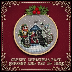 May include: A cross-stitch embroidery hoop with a winter scene featuring three figures, a house, and a snowy landscape. The text "Creepy Christmas Past, Present and Yet to Come" is written below the hoop.