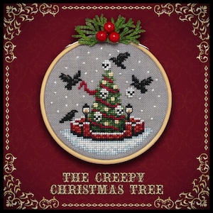 May include: A cross-stitch embroidery hoop with a creepy Christmas tree design. The tree is decorated with skulls and is surrounded by black birds. The text "THE CREEPY CHRISTMAS TREE" is below the hoop.